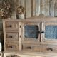 Small piece of furniture with glass doors and drawers