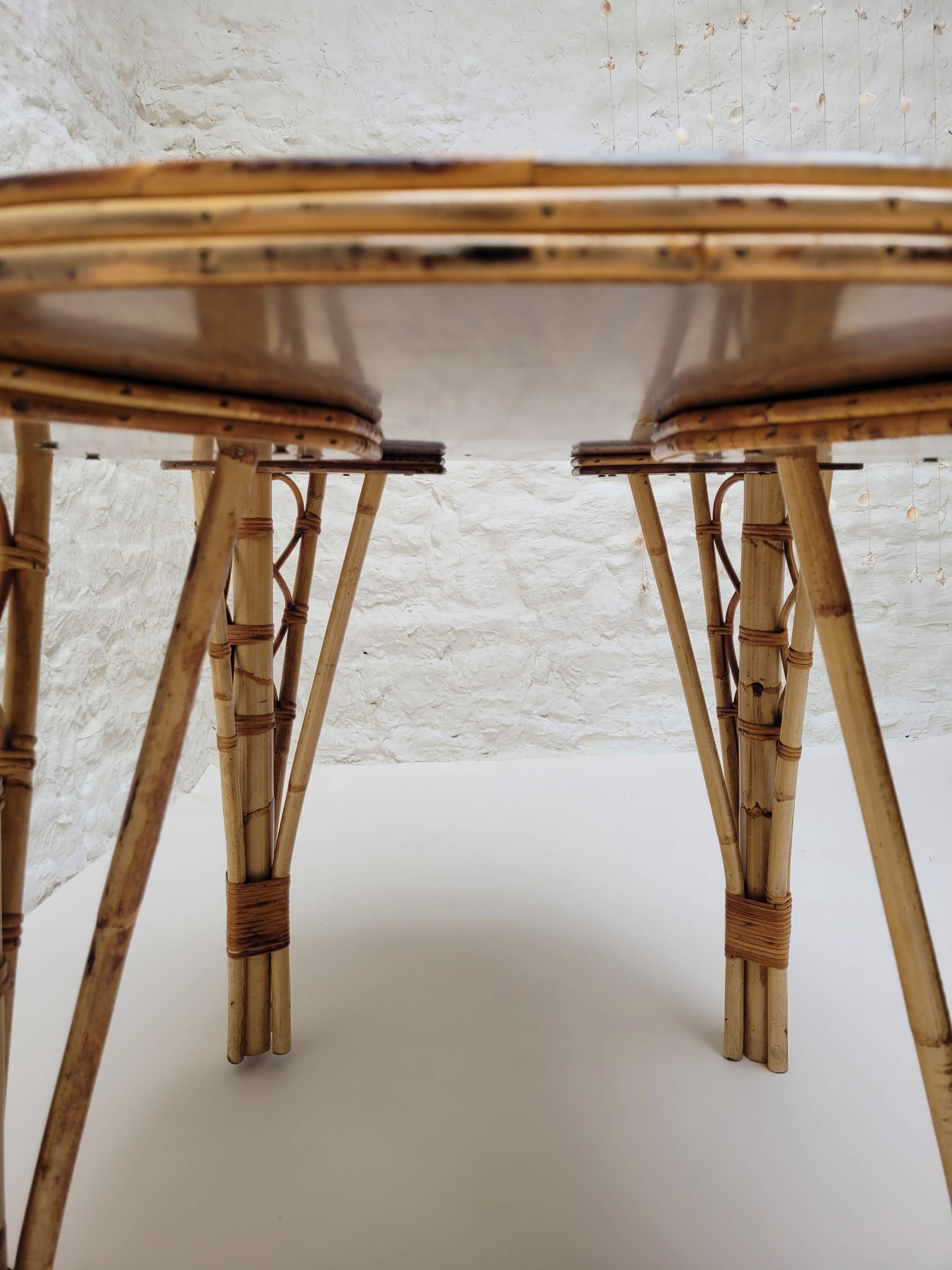 Vintage Audoux Minet bamboo, rattan, and smoked glass table duo.