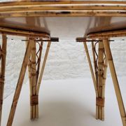 Vintage Audoux Minet bamboo, rattan, and smoked glass table duo.