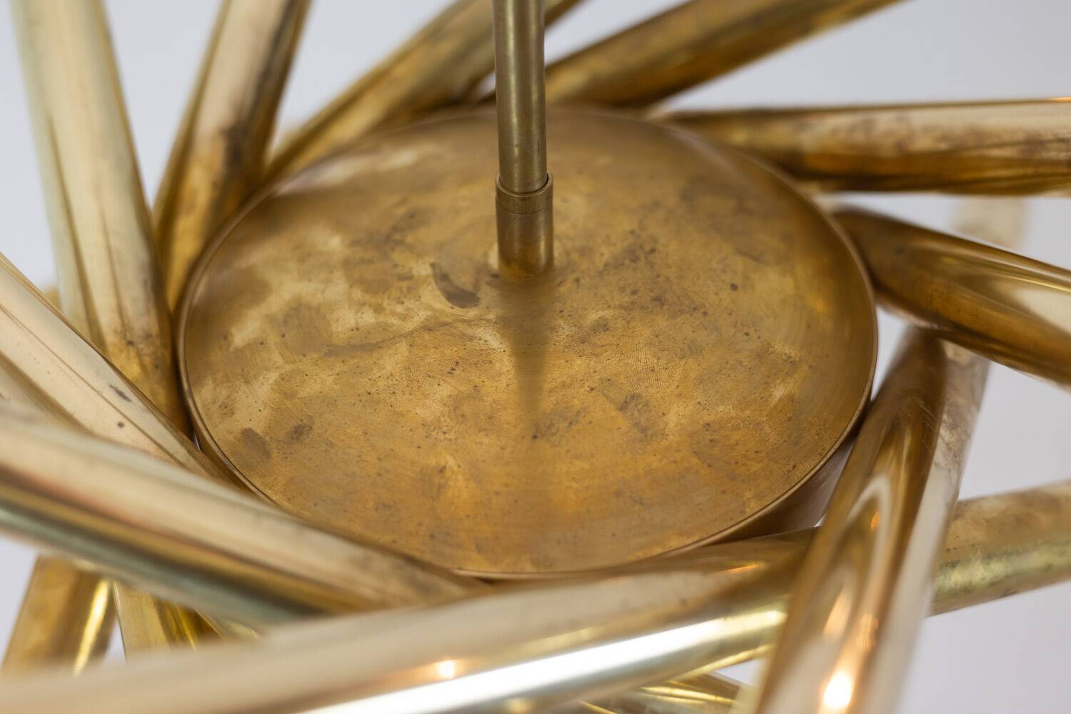 Pair of matte gold-plated brass chandeliers. Italian work from the 1970s.