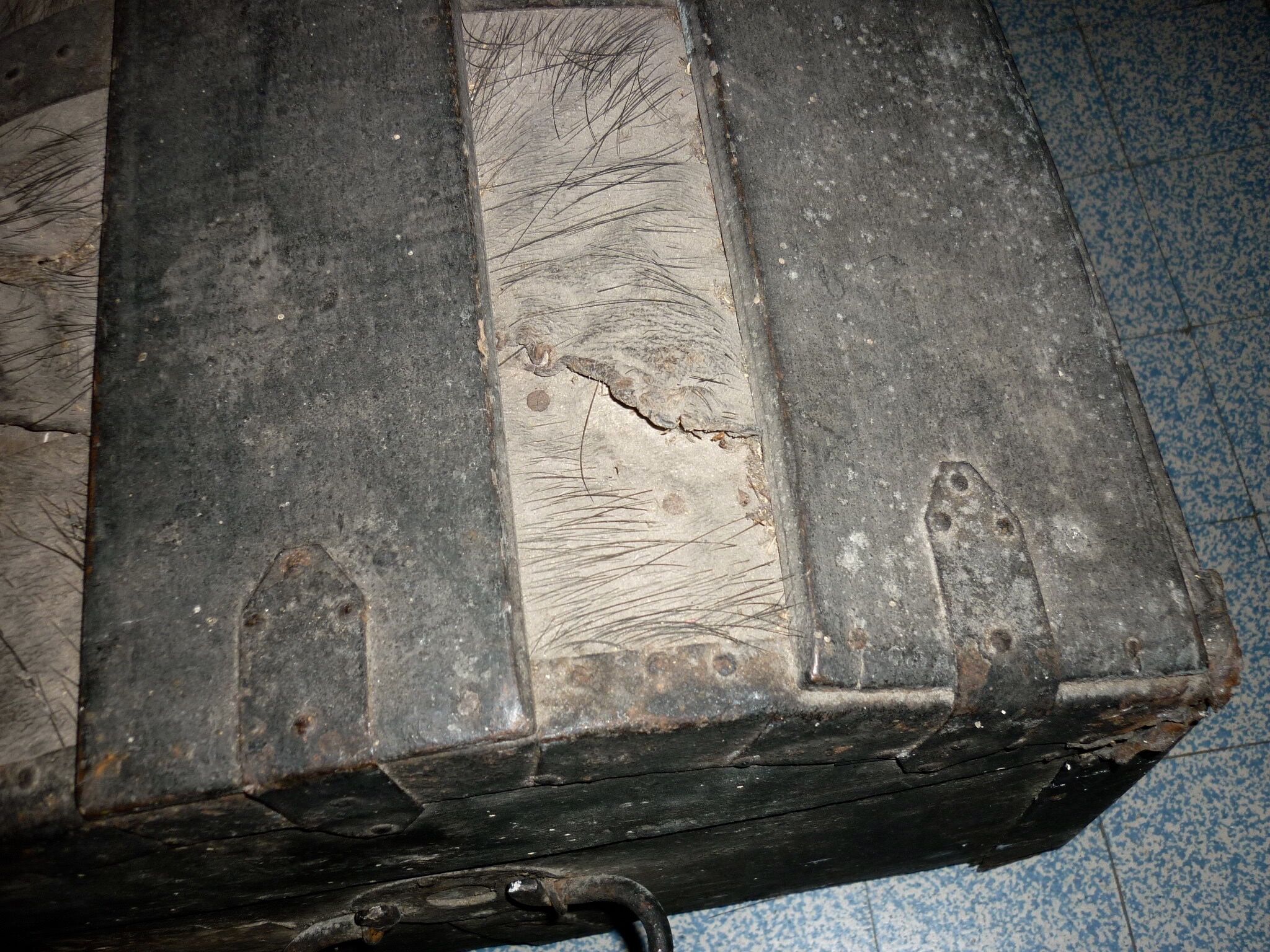 Old bulging wooden travel trunk