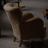 Pair of Danish Art Deco modern lounge chairs in sheepskin with lambswool and elm, 1940s.