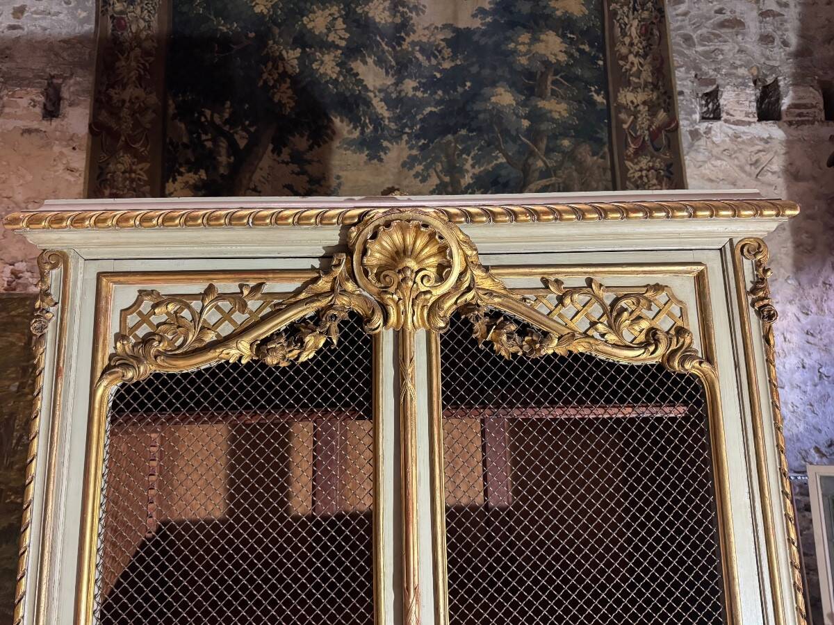 Bookcase in gilded wood and restored wood from the Napoleonic III period.