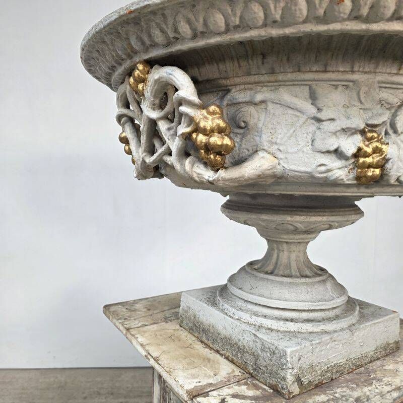 Large pair of 19th-century cast iron basins with vine decoration.
