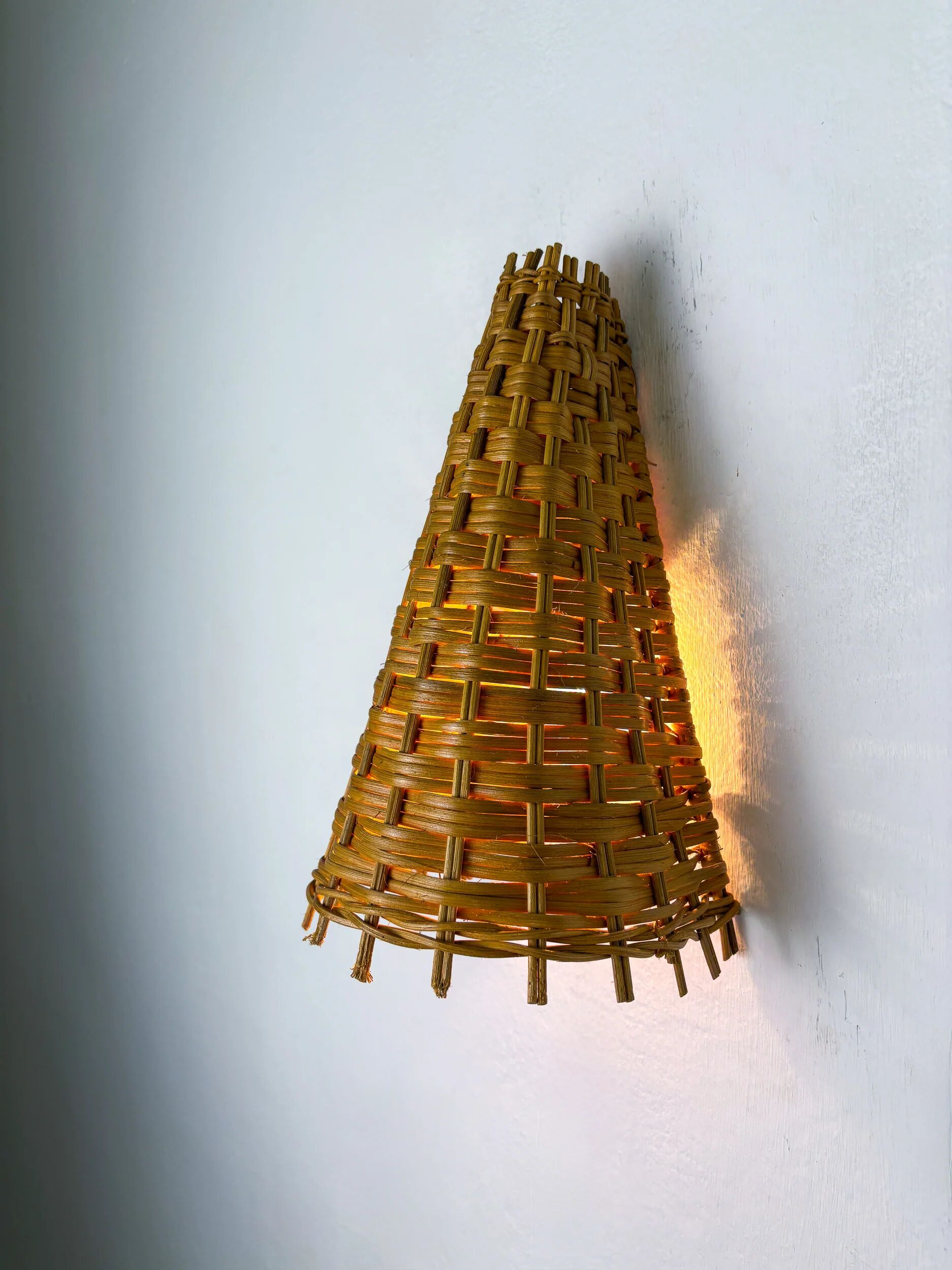 Pair of mid-century rattan wall shades, Italy, circa 1960s