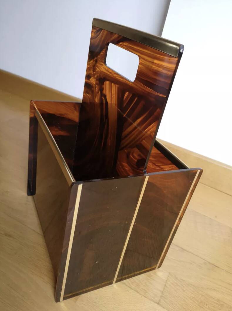 Tortoiseshell lucite magazine rack from the Christian Dior Home collection.