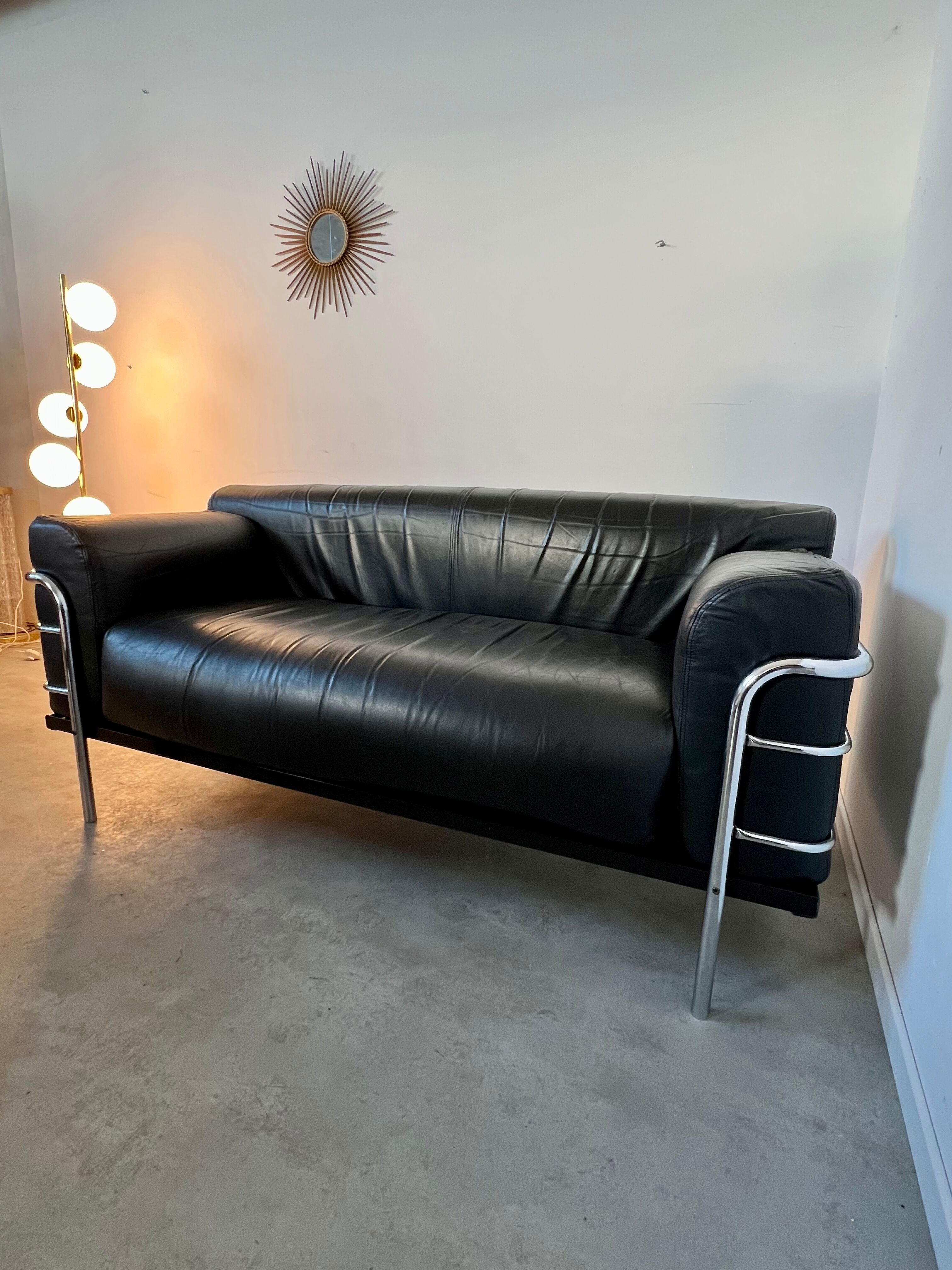 Old vintage leather and tubular metal sofa, design 70s