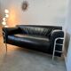 Old vintage leather and tubular metal sofa, design 70s