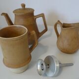Old coffee maker and sandstone pitcher