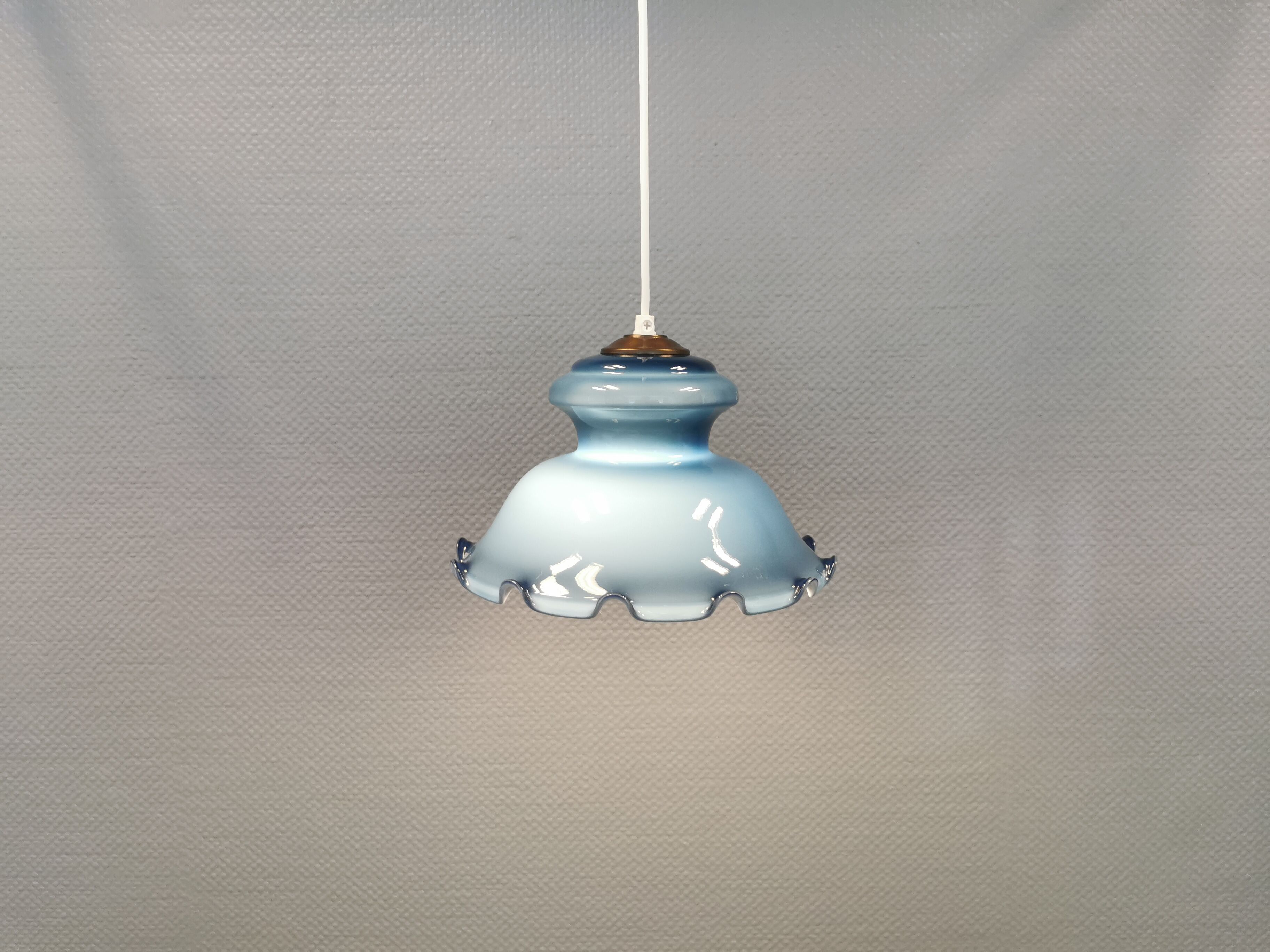 Hanging lamp in double layer opal glass, blue on the outside and white on the inside.