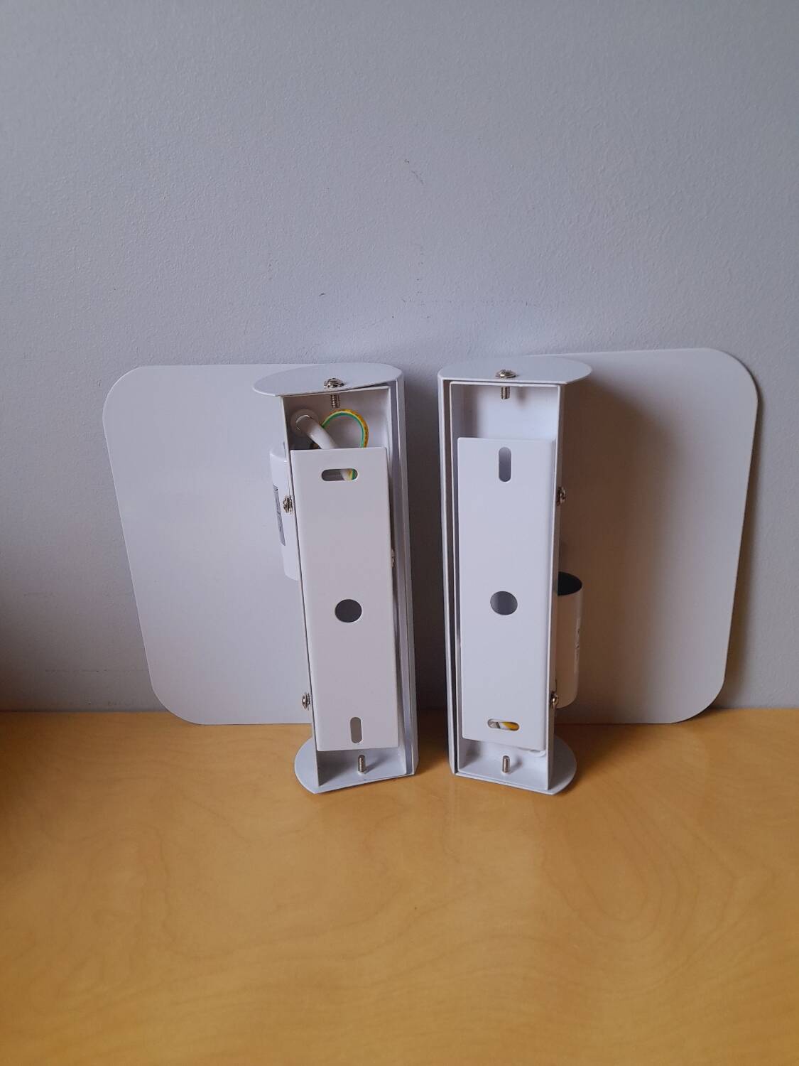 White lacquered metal wall sconces