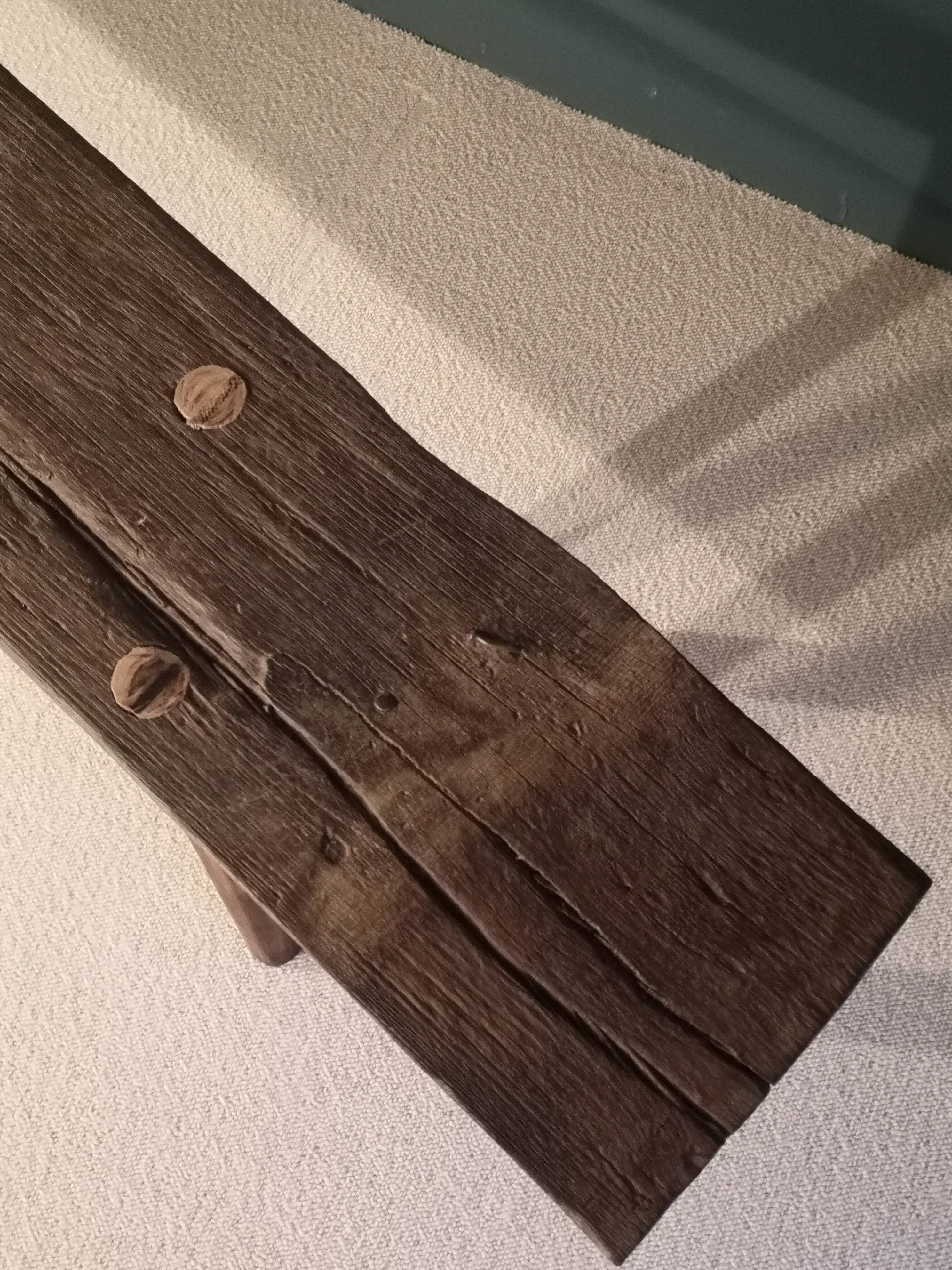 Old rough bench made of solid wood