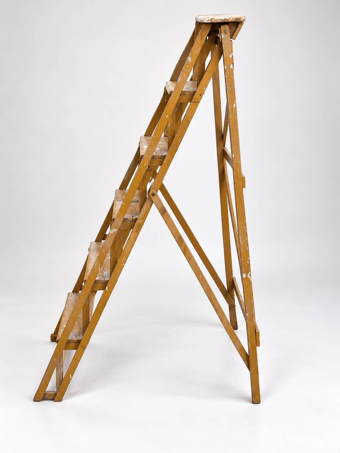 Vintage wooden painter's step ladder with a patina.
