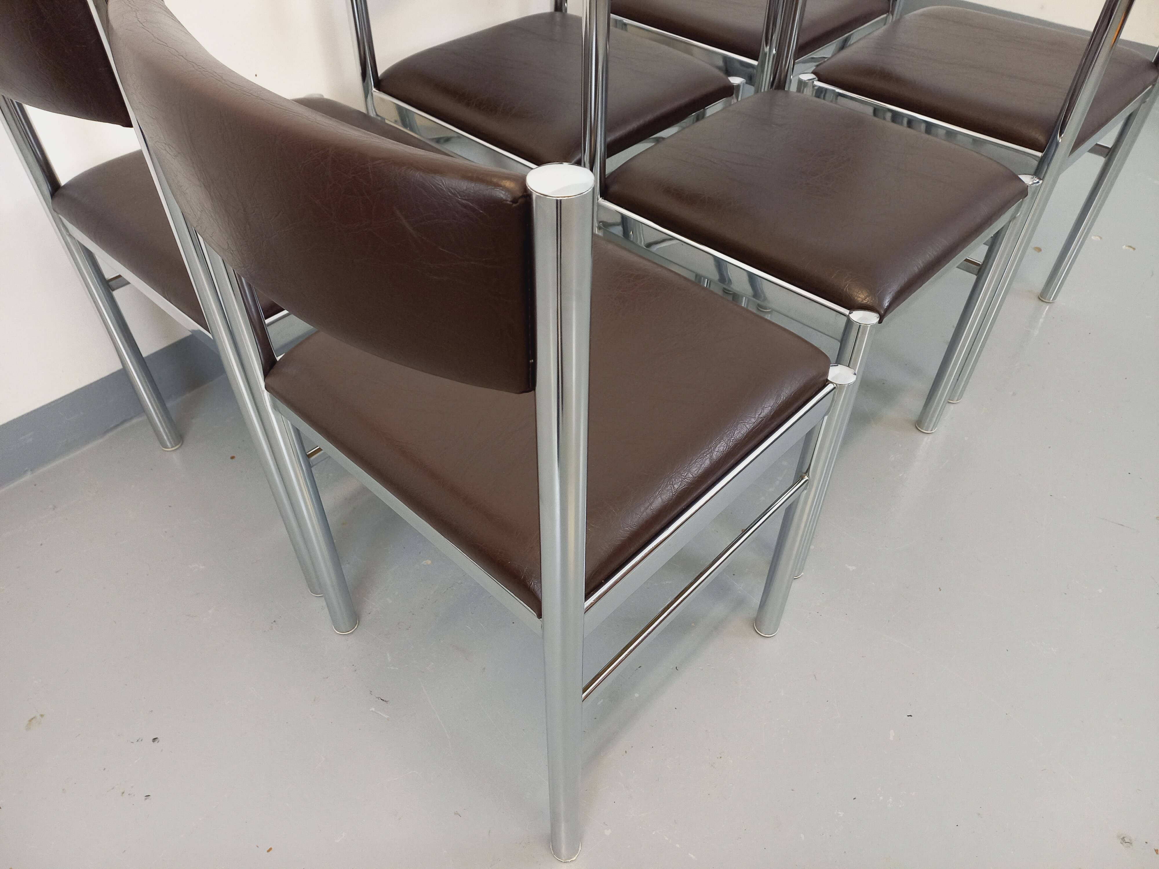Set of 6 vintage chairs from the 70s in chrome metal and brown faux leather.