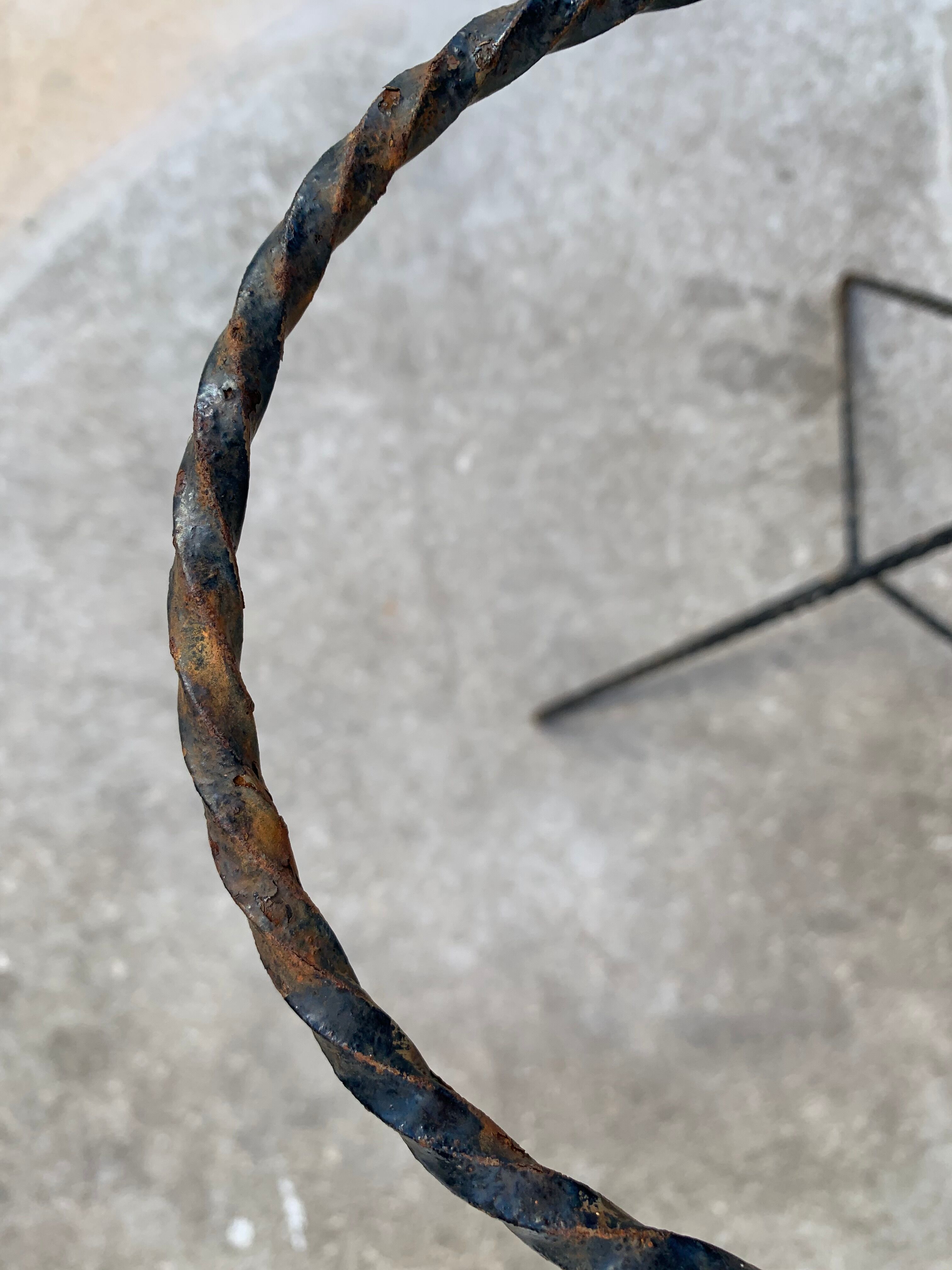 Black metal tripod plant holder