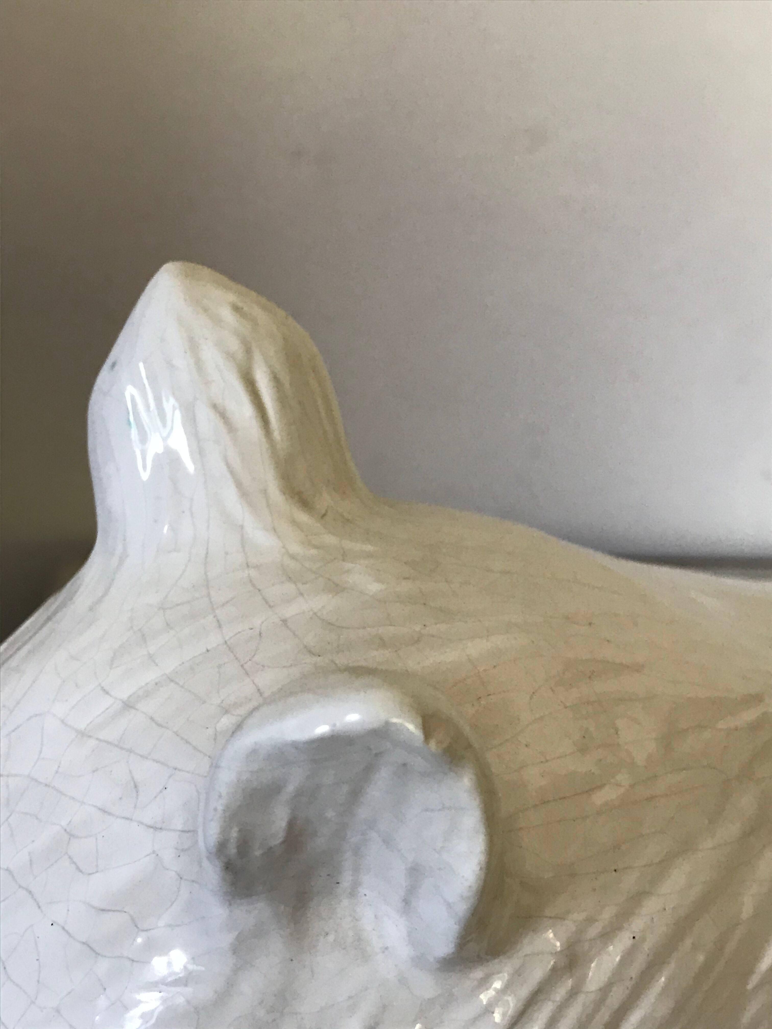 Cracked ceramic zoomorphic pot cache