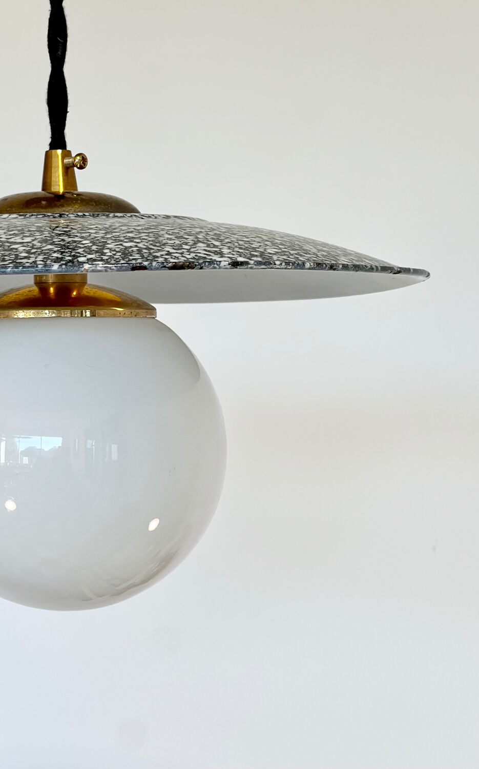 Industrial pendant light made of speckled enameled sheet metal and opaline