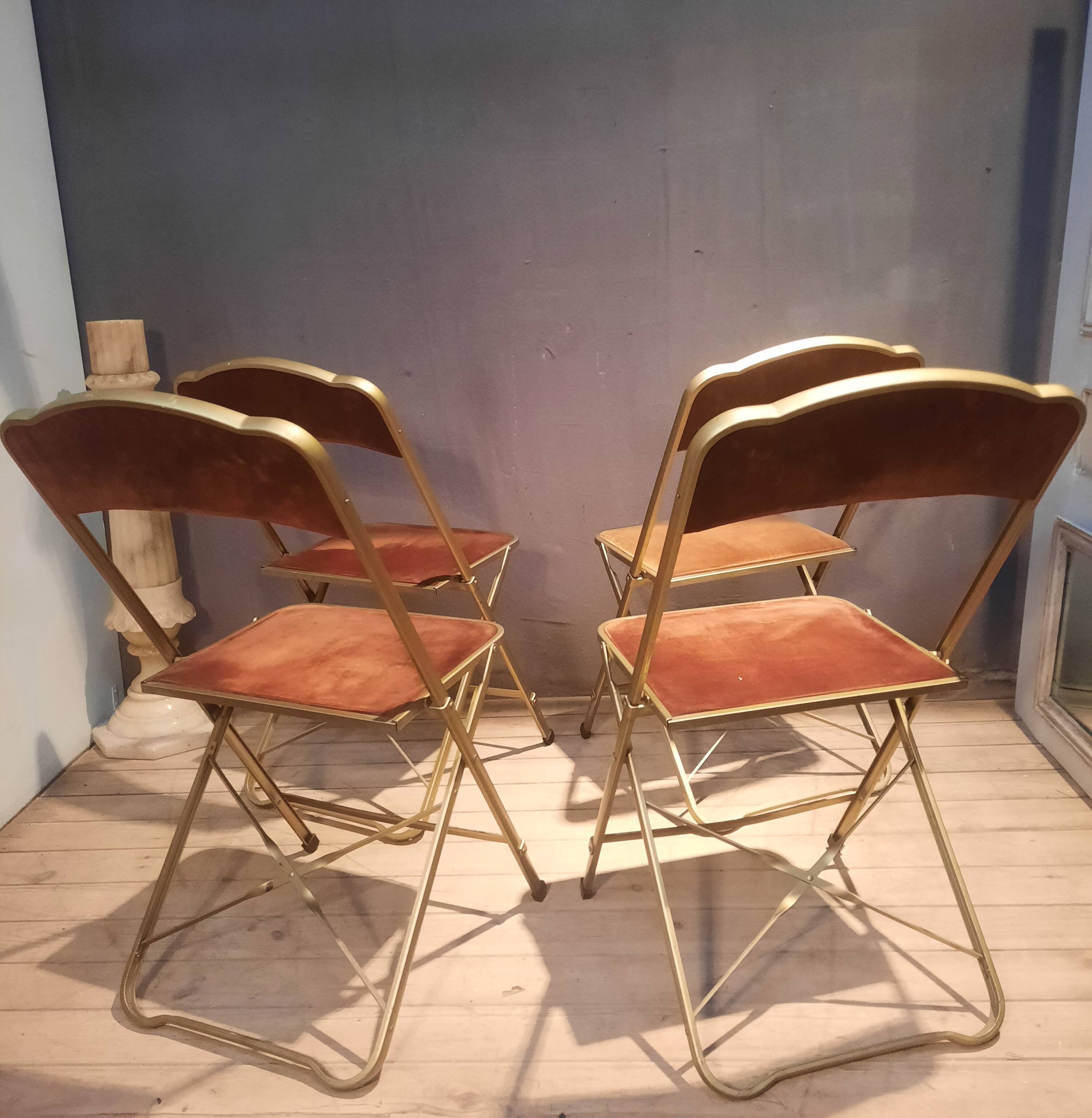Set of four folding metal and velvet chairs
