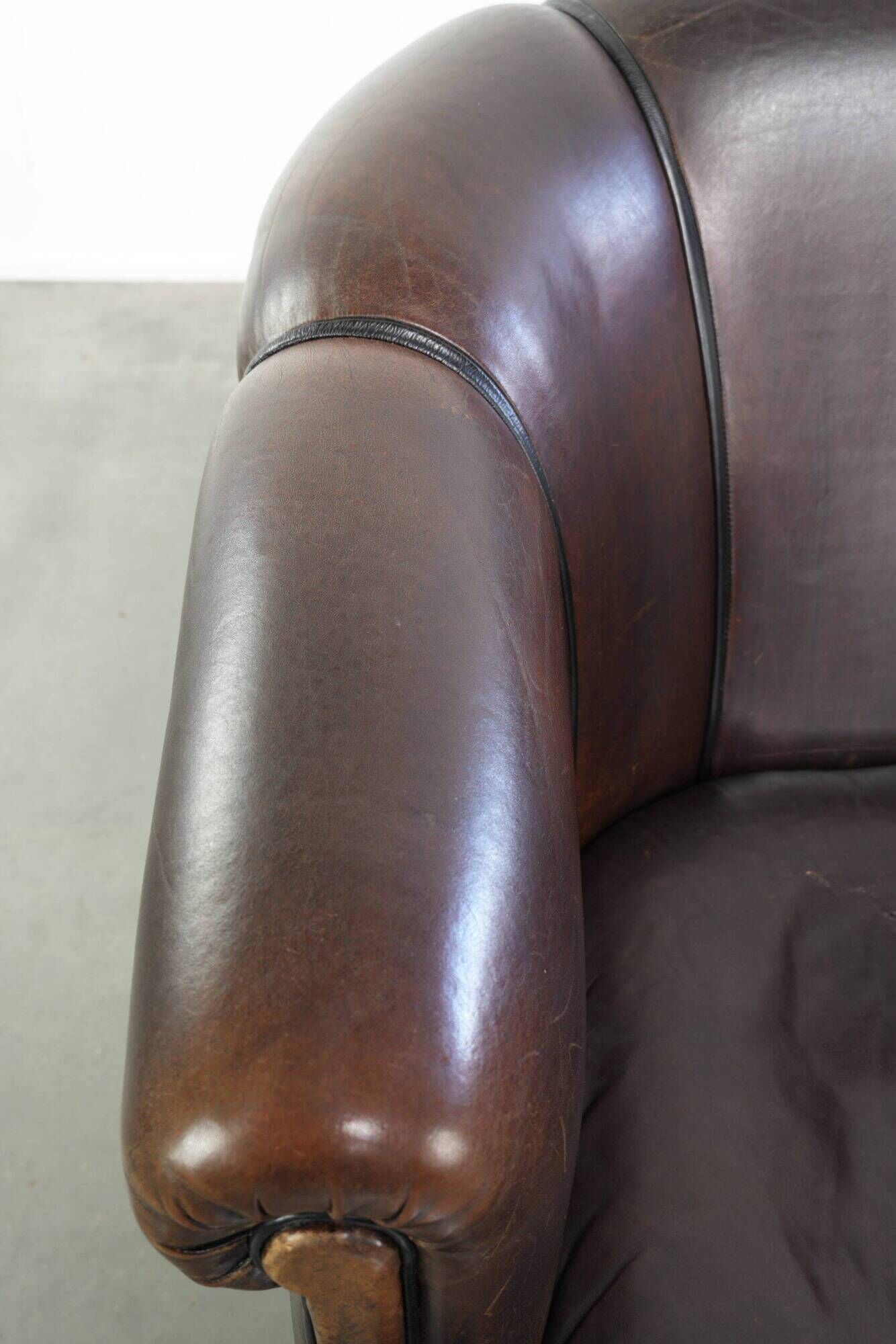 Set of a sheepskin sofa together with its matching club armchair