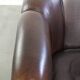 Set of a sheepskin sofa together with its matching club armchair