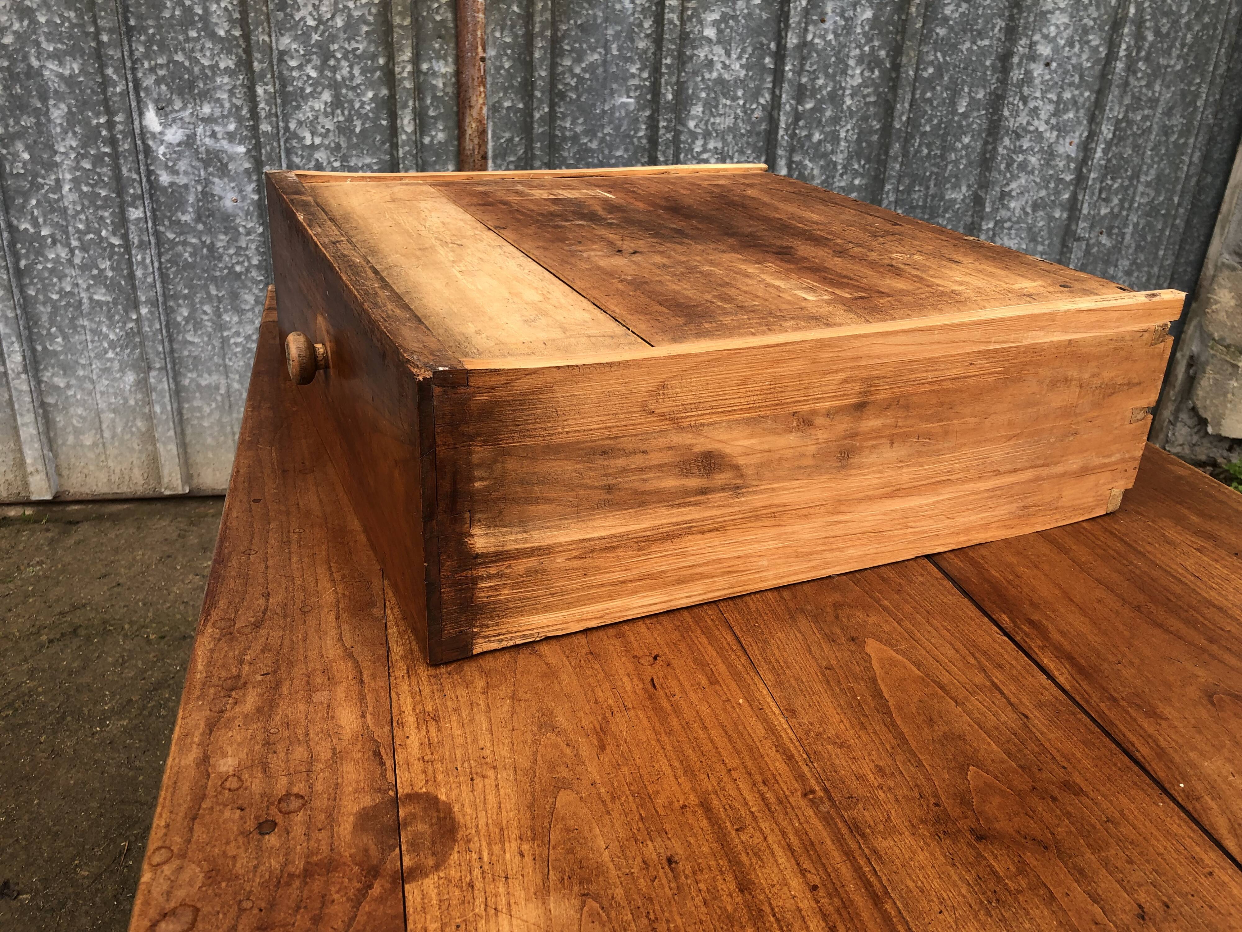 Antique solid cherry farmhouse table with 2 end drawers and 1 pull-out.