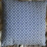 Blue cushion with royal pattern