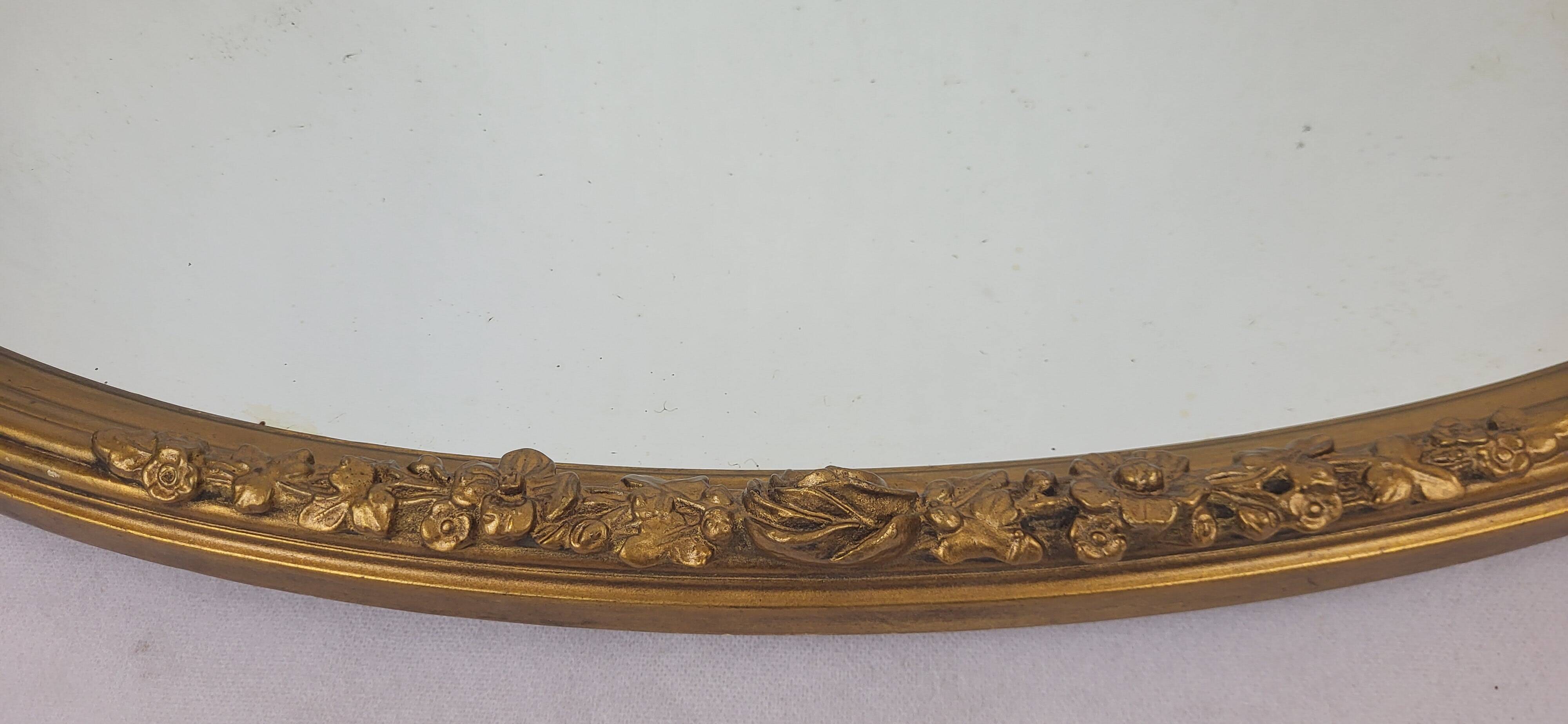 Miroir ovale en bois doré, style Louis XVI
