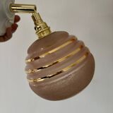 Vintage globe wall light in frosted pink and gold glass.