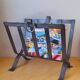 Brutalist magazine rack in forged steel, 1950.
