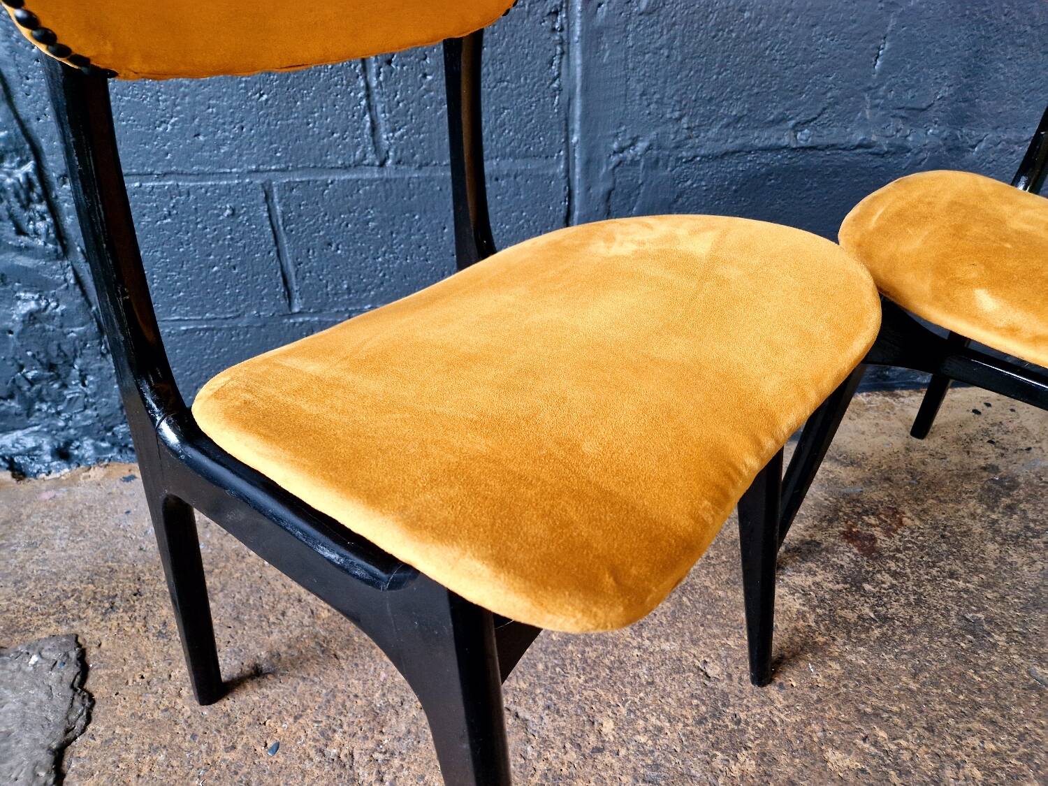 2 vintage chairs in black lacquered wood and yellow/mustard fabric, 1960
