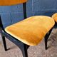 2 vintage chairs in black lacquered wood and yellow/mustard fabric, 1960