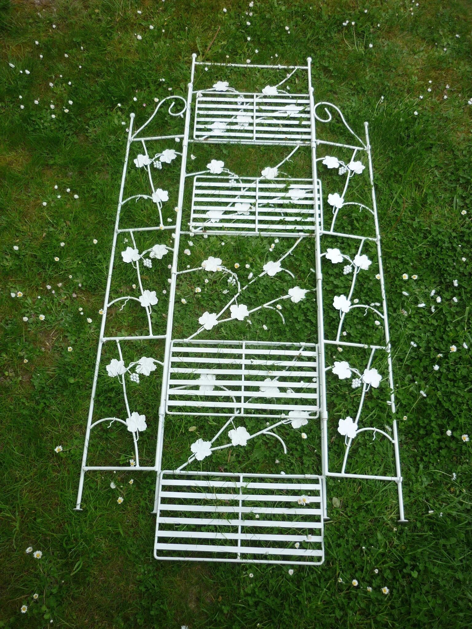 Folding white wrought iron shelf