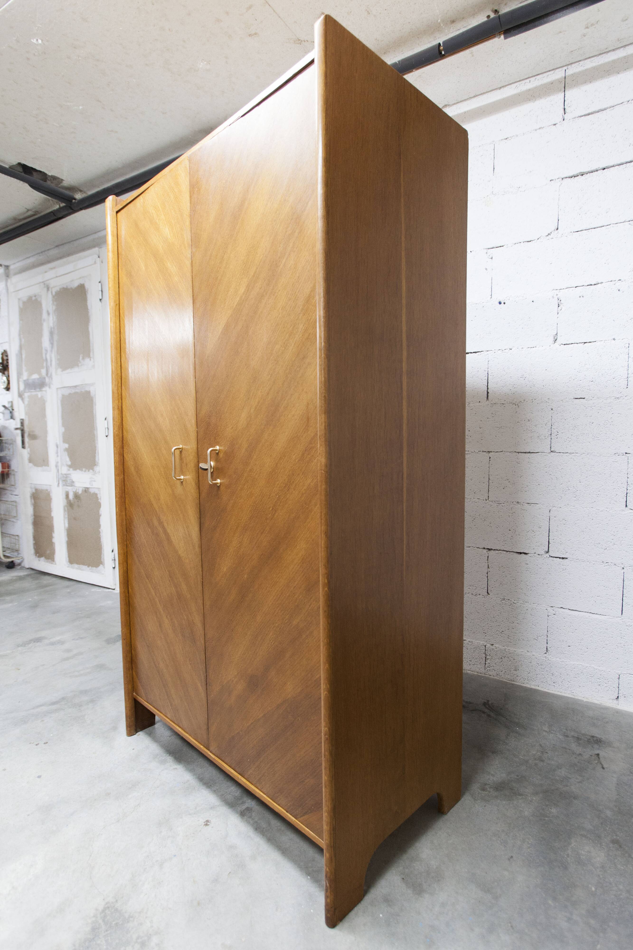 1950s Mid-Century Modern oak armoire with two doors and two drawers.