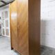 1950s Mid-Century Modern oak armoire with two doors and two drawers.