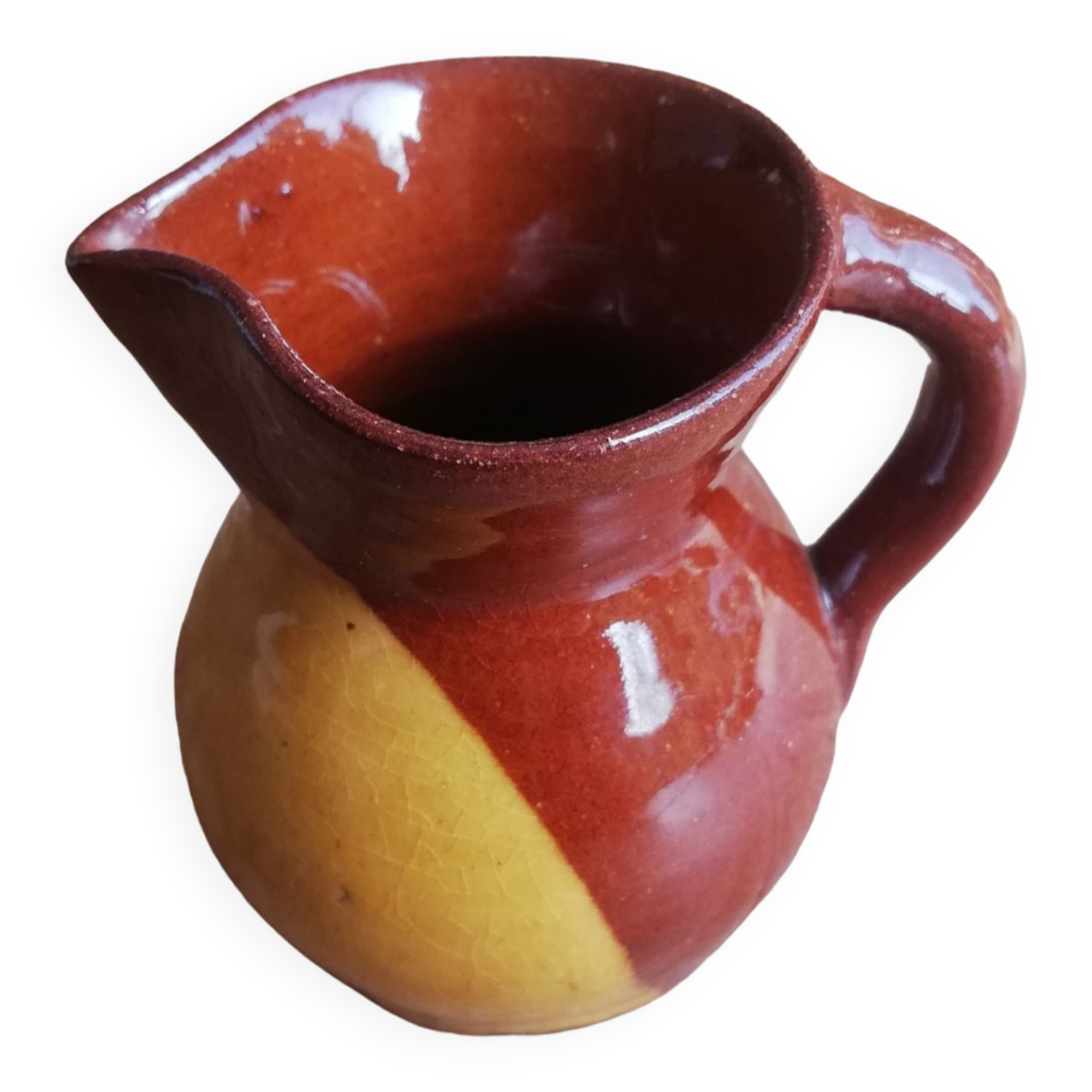 Small two-tone brown-yellow terracotta pitcher