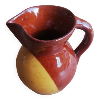 Small two-tone terracotta pitcher yellow brown