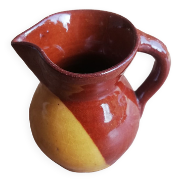 Small two-tone brown-yellow terracotta pitcher