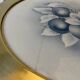 Art Nouveau plate in earthenware with a brass frame