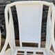 Pair of white rattan armchairs