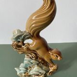 Ceramic squirrel on branch