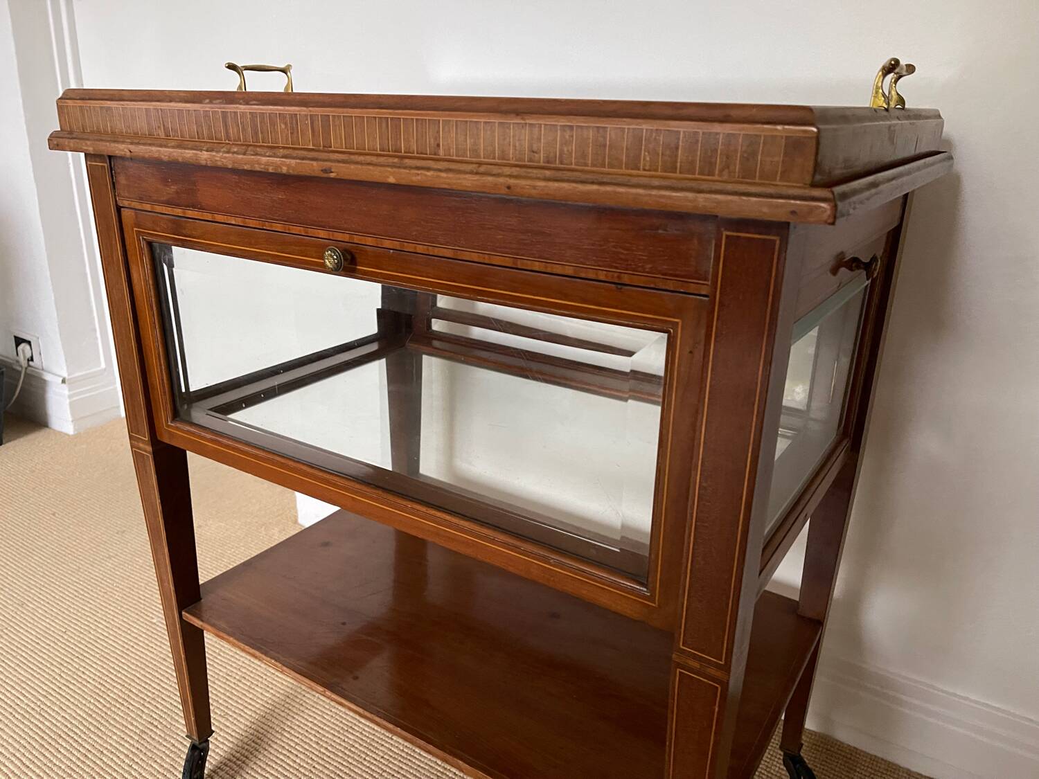 Serving Light mahogany English tea table. Beveled windows. circa 1900. Removable glass top.