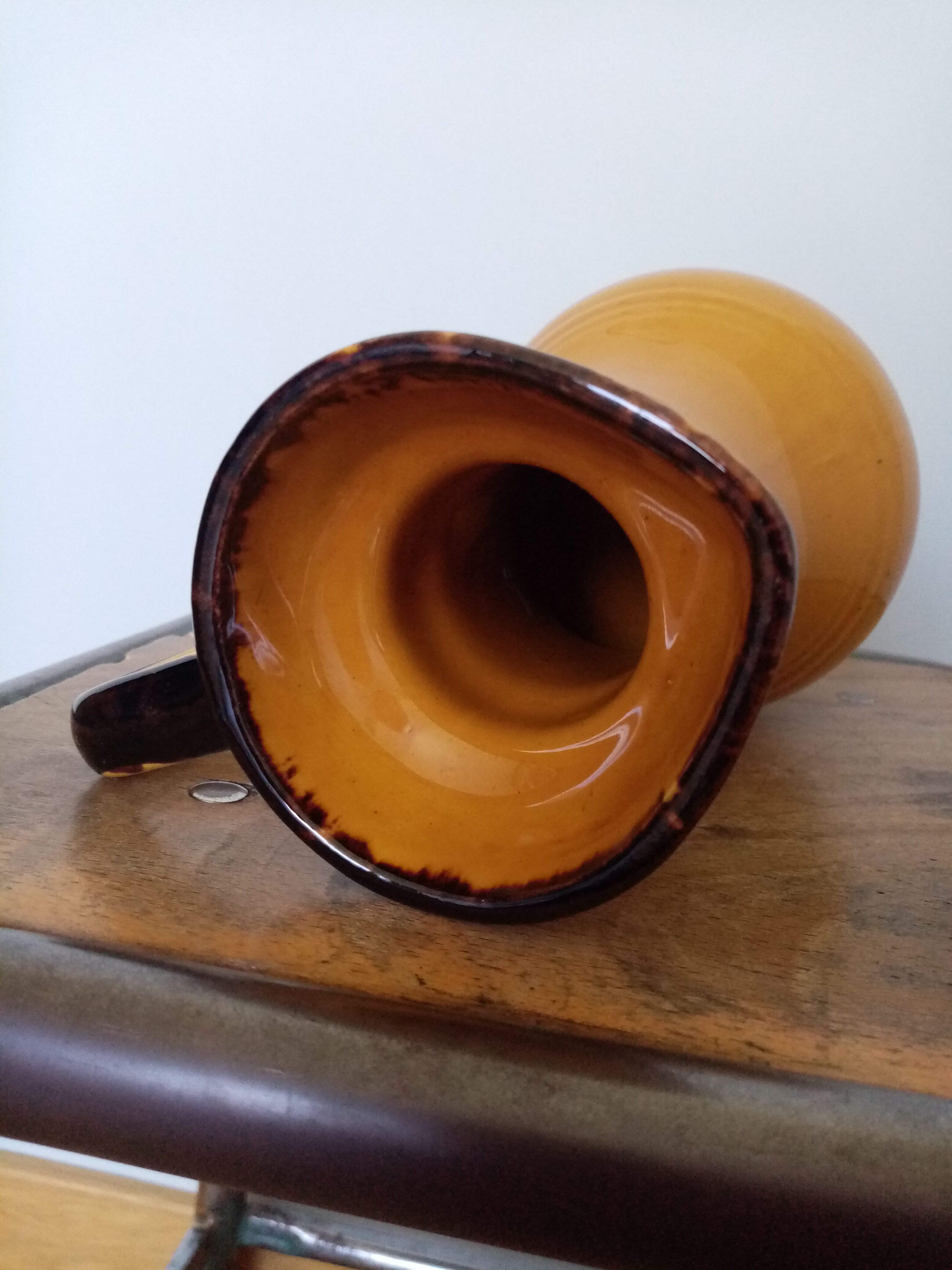 Mustard yellow enamelled ceramic pitcher