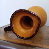 Mustard yellow enamelled ceramic pitcher