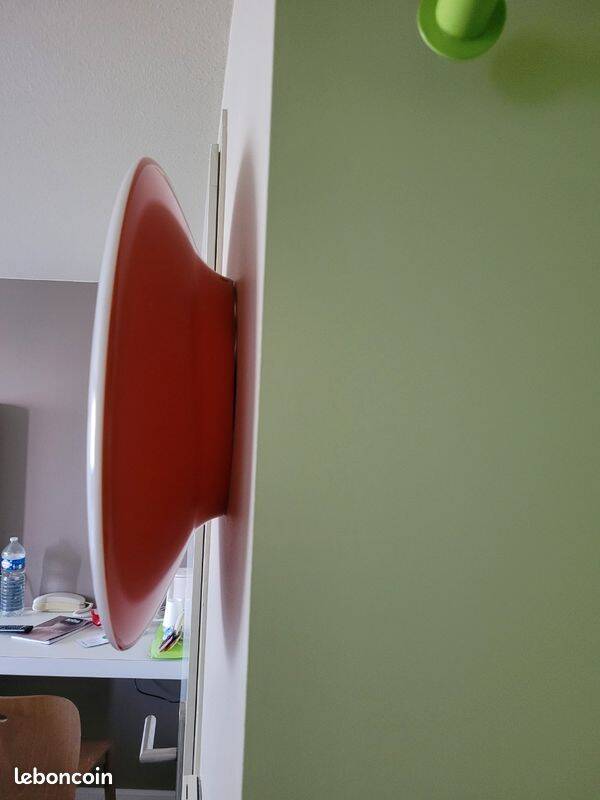 Oval wall lamp Artemide Italy design Patrick Jouin orange and white.