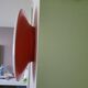 Oval wall lamp Artemide Italy design Patrick Jouin orange and white.