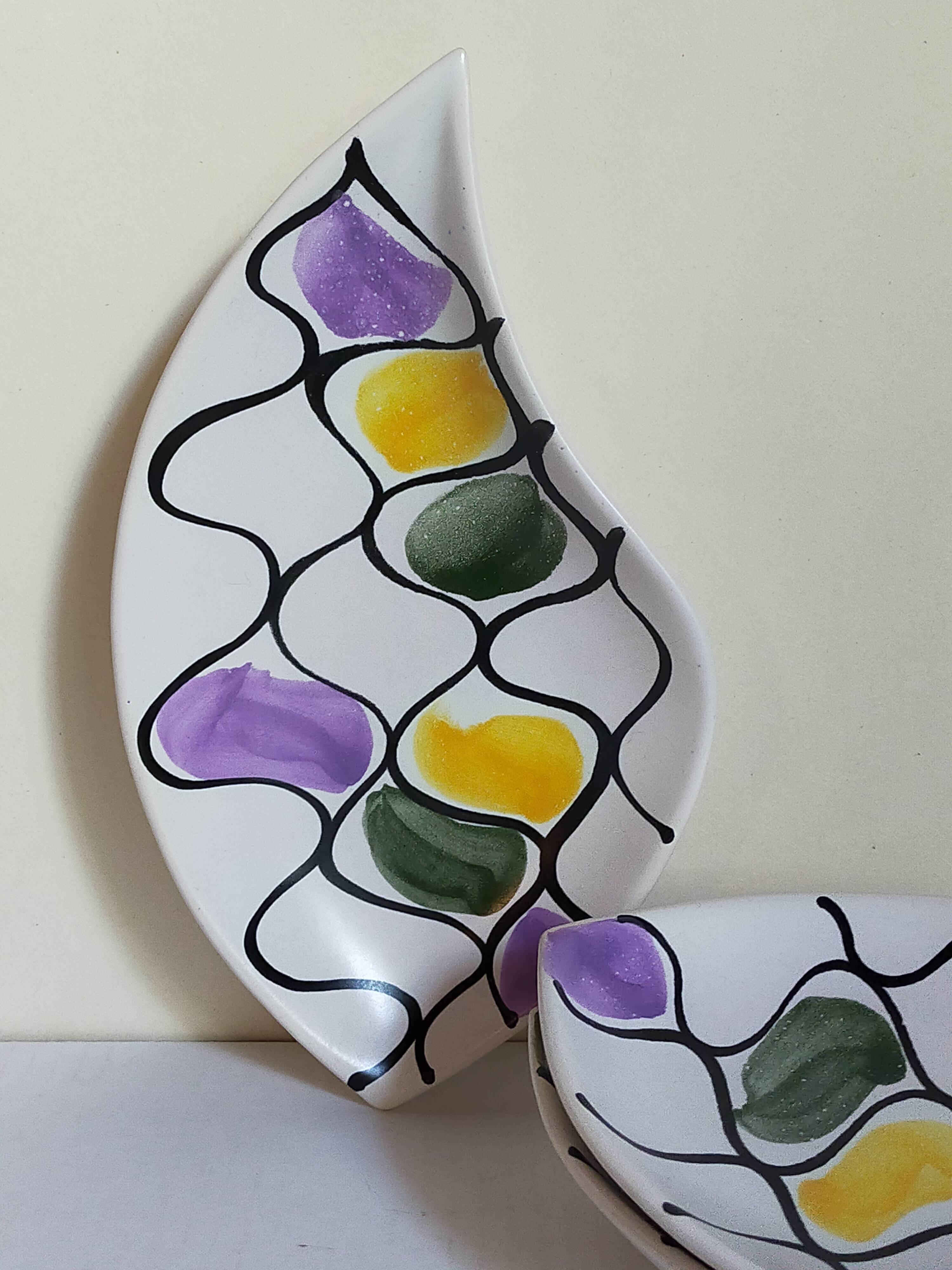 Three vintage free-form ceramic ravine dishes from the 1950s