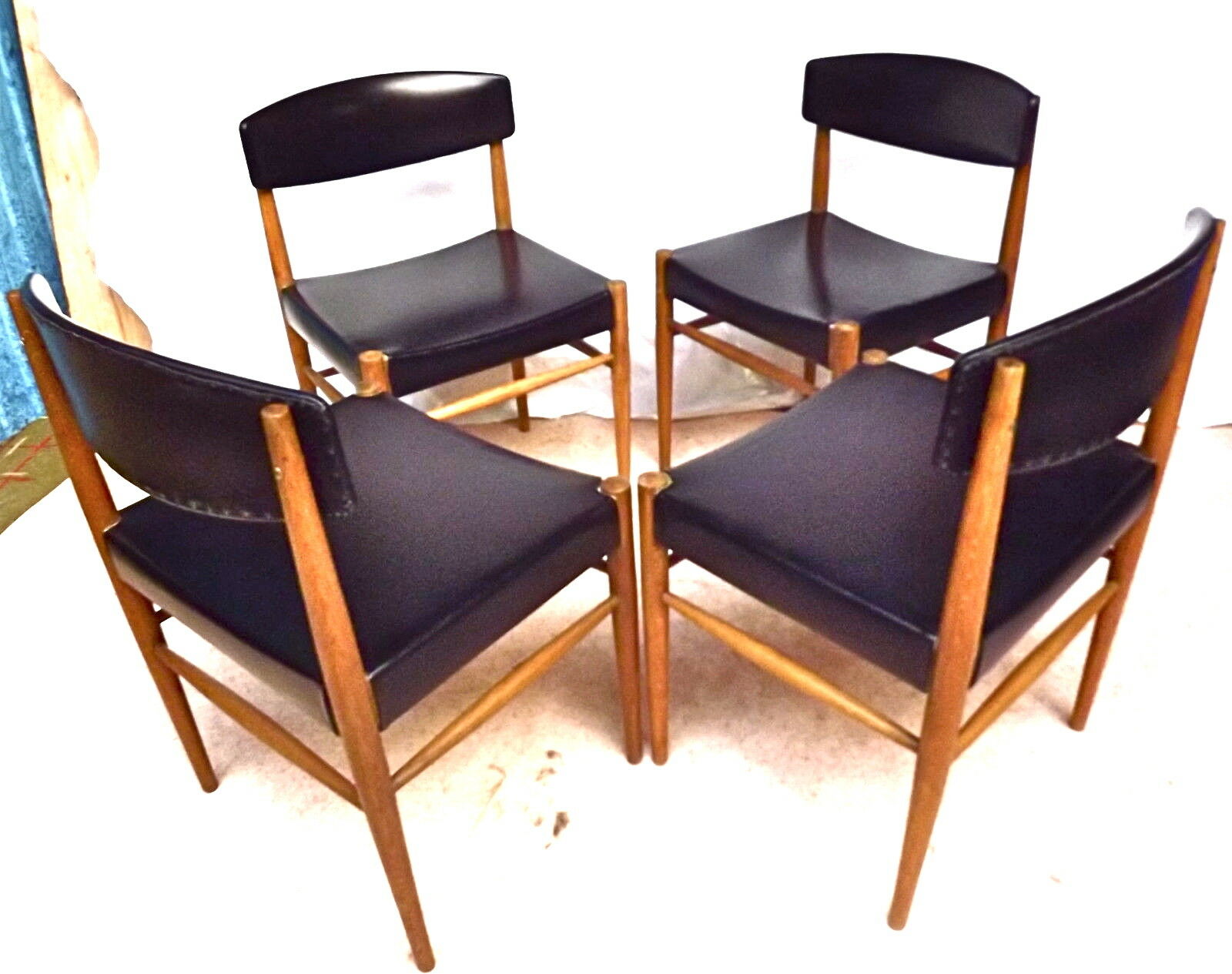 Four Scandinavian-style chairs