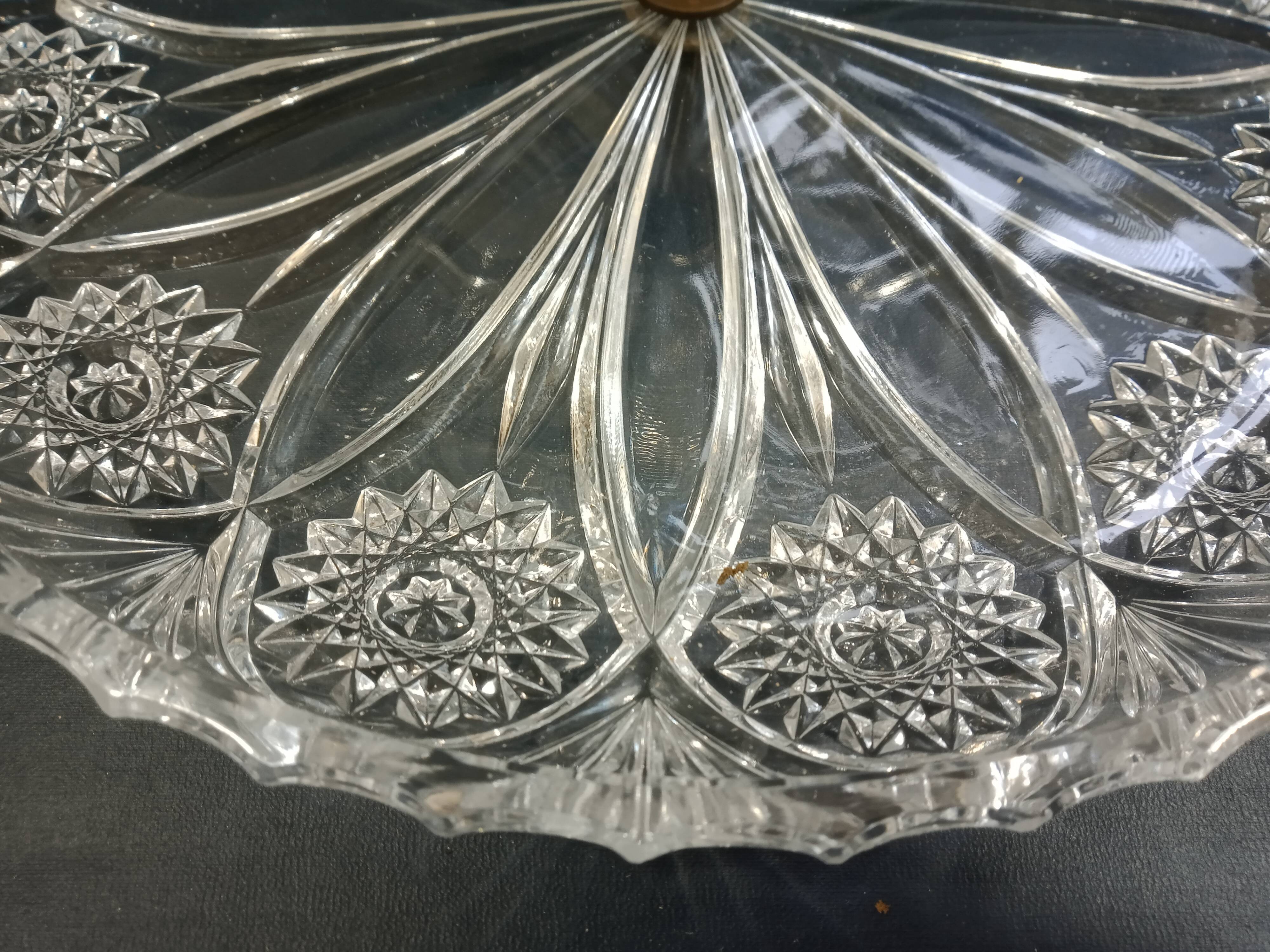 Three-storey display in chiseled glass and brass