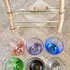6 Old multicoloured liqueur glasses with bamboo stand