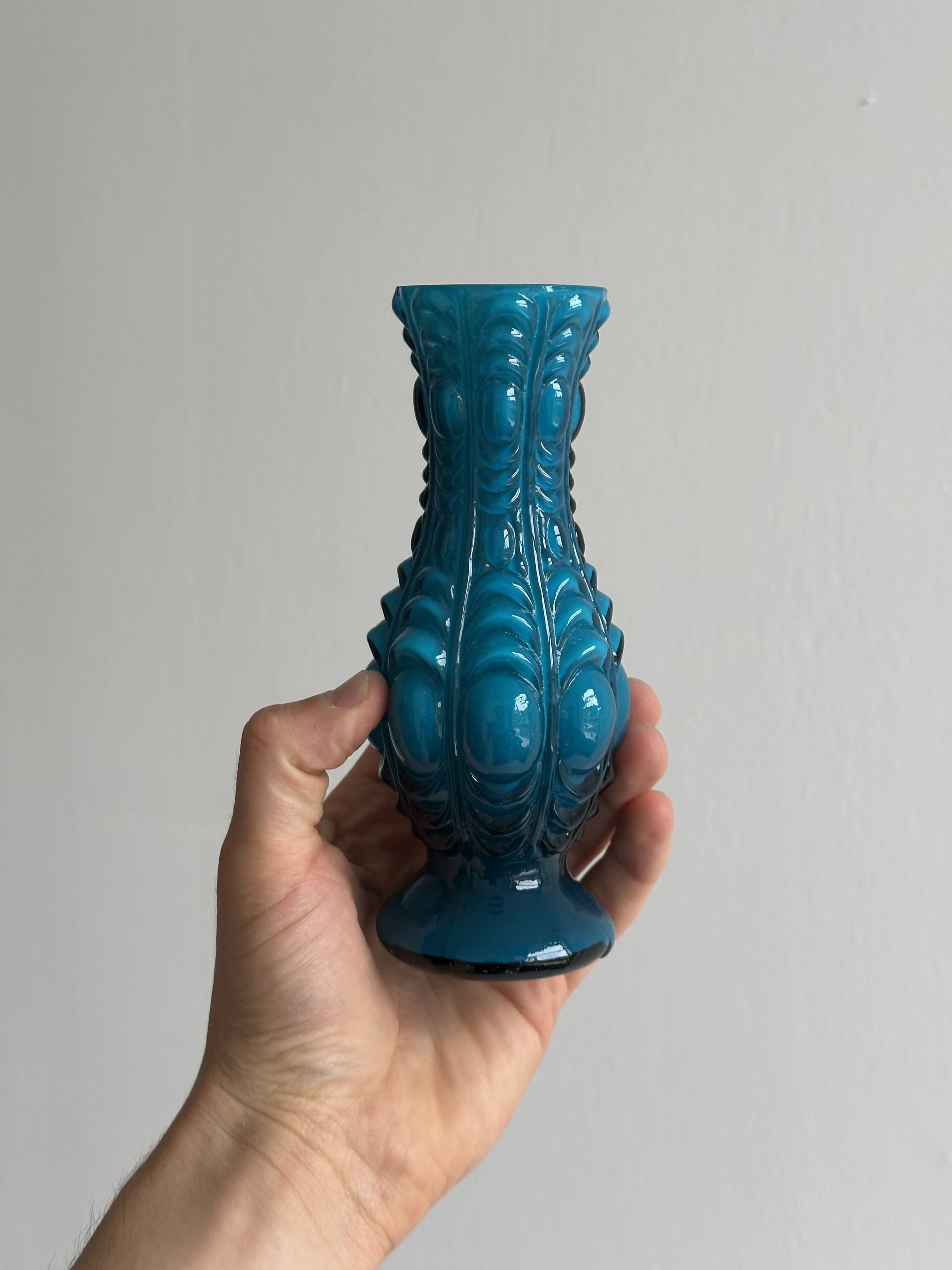 Small deep blue vase with reliefs